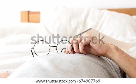 Men hold glasses sleep no bed  with after reading
