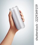 men holding aluminum can with condensation droplet. isolated on grey background.