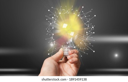 Men Holding Light Bulbs, Of New Ideas With Innovative Technology And Creativity.