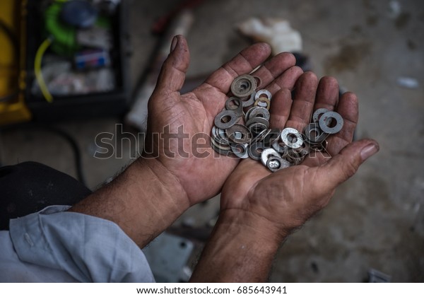 Men holding spare parts in
hand