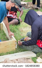 Men Install A Community Garden