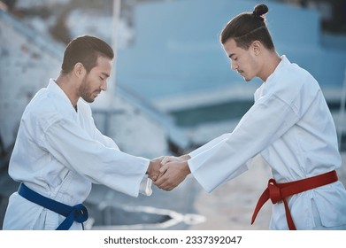 Men, karate and shaking hands at training fight with respect, fitness and start workout contest for development. Martial arts coaching, together or peace for exercise, zen mindset or combat sports - Powered by Shutterstock