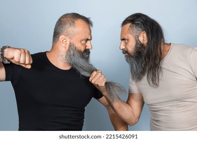 Men With Long Beard In Aggressive Attitude. Studio Shot