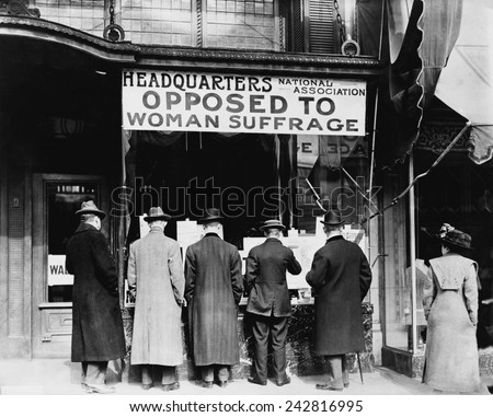 Men looking in the window of the National Anti-Suffrage Association headquarters, National Association Opposed to Woman Suffrage was active at the state and national. Ca. 1911.