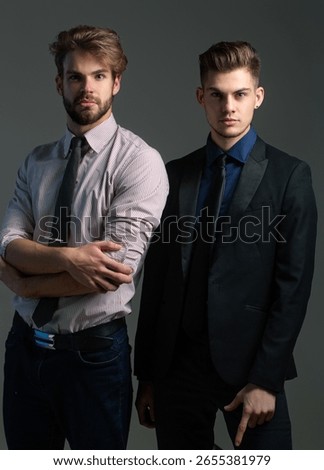 Men models posing in studio. Sexy gay couple showing fashion style. Stylish guys pride. Handsome boyfriend in elegant outfit. Trendy male models. Fashion men posing. Stylish gay couple.