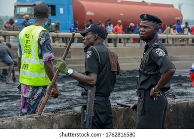 Men Of The Nigerian Police Force At The Scene Of An Explosion On Kara Bridge, Lagos, Nigeria, June 21, 2020