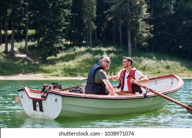 Men on a rowboat during fishing trip 