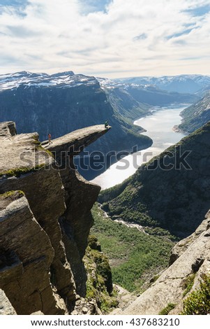 Men on Trolltunga (Devil's tongue), Hordaland, Norway