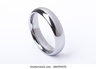 A Men Plain Wedding Ring Band Made Out Of Silver And Gold On An Isolated White Studio Background