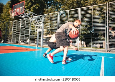 Men Playing Basketball Dribbling Close Up Wide Angle Outdoors