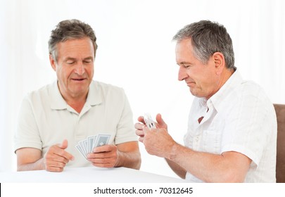 Men Playing Cards On The Table