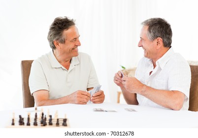 Men Playing Cards On The Table