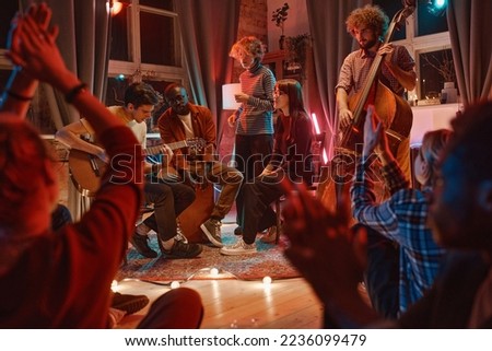 Men playing on musical instruments for friends