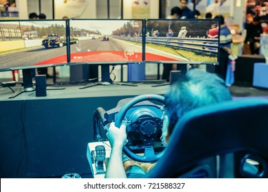 Men Are Playing A Racing Game. Joy Games Driving Gamer. 