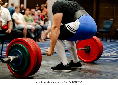 men powerlifter deadlift competition in sport gym with fans - Powered by Shutterstock