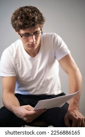 Men reading a contract focus on the hands - Shutterstock ID 2256886165