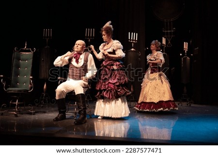 Men in retro old clothes frock coats and uniforms and women in medieval dresses with lush skirts  Foto stock © 