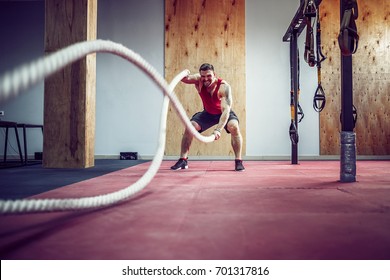 Men With Rope In Functional Training Fitness Gym In A Crossfit Workout