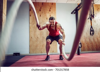 Men With Rope In Functional Training Fitness Gym In A Crossfit Workout