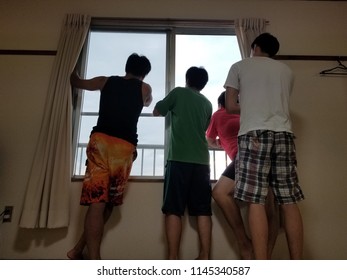 Men seeing the outside from the window