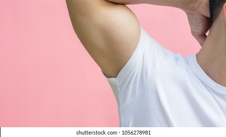 Men Showing His Armpit On A Pink Background.