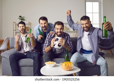 Men Sitting On Sofa, Eating Snacks, Drinking Beer, Watching Football Game On TV, Shouting Yeah, Yes, Hooray. Ecstatic Friends Cheering For Favorite Soccer Team And Screaming Hurray After Scoring Goal