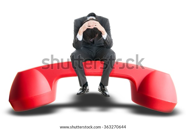 Men sitting on top of the red handset, trouble