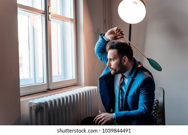 Men In A Suit Hitting A Fly With A Fly Swatter.