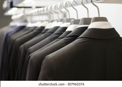 Men Suits Hanging In A Clothing Store.