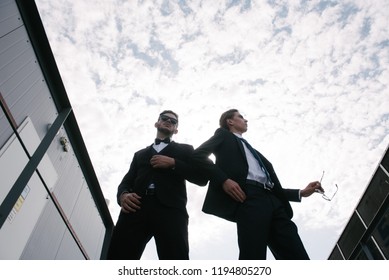 Men in suits posing