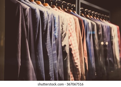 Men Suits In A Showcase Of A Clothing Shop.