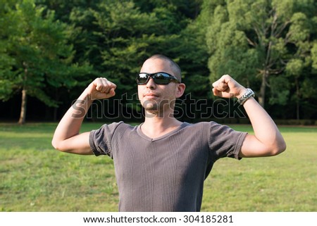 Similar – Portrait of a young man in the bamboo jungle