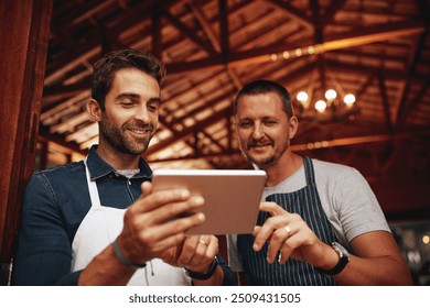 Men, tablet and barista with pride, small business and colleagues as entrepreneur in cafe. Male people, waiter and technology in industry, hospitality or customer service with confidence at workplace - Powered by Shutterstock