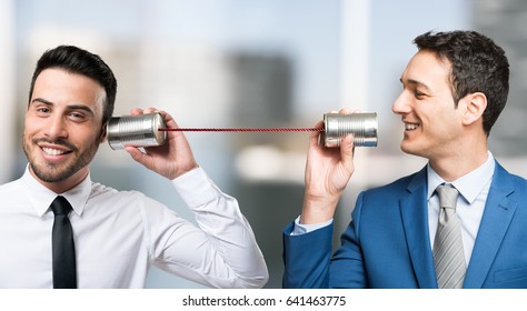 Men Talking On Tin Can Phone