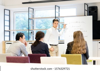 Men teaching English in the classroom (Japanese / English)