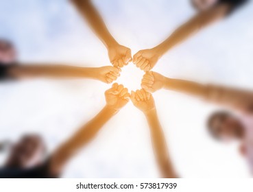 Men Team Put All Hands Together Under Blur Background, Circle Shape Hand Of Team