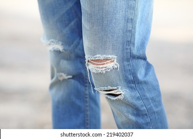 men in torn jeans