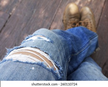 men in torn jeans closeup