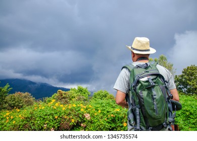 Men Travel To Visit The High Mountains During Variable Weather.