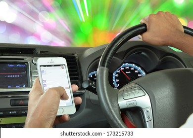 Men Use The Telephone To Send Text Messages To Friends While Driving At Speeds Of 70 Miles Per Hour On The Dial. Danger Of Accidents And Is Illegal By The Government 