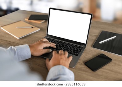 men using laptop computer working at office workspace with blank display white desktop screen monitor frame empty mockup for copy template advertising communication space