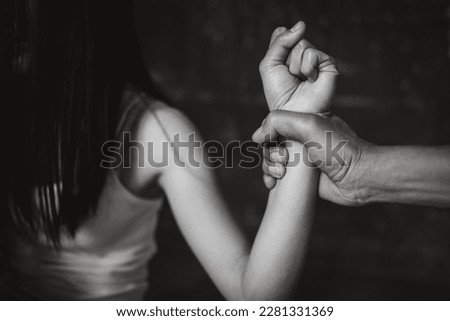 Men are violently assaulting their women, Husband beating and smothering wife during argument, Woman victim of domestic violence and abuse, Domestic violence concept.
