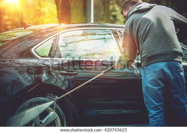 Men Washing His Car Using High Water Pressure
Washer. Car Washing.