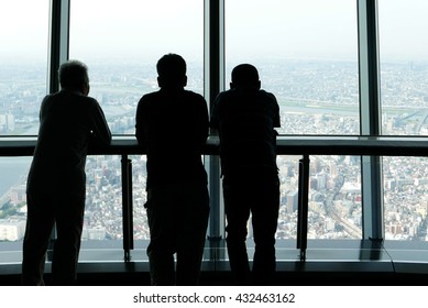 men watch Japan Tokyo city from a tower
