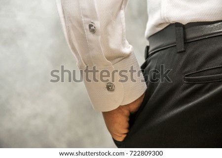 Men wear brown long-sleeved shirts in the dressing room.,Shirt button Stock photo © 