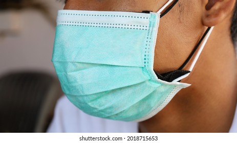 Men Wear Double Masks. Different Colored Masks Worn At The Same Time For More Confident Protection Than Usual In The Severe Covid Epidemic Situation Around The World. Select Focus At Close Range