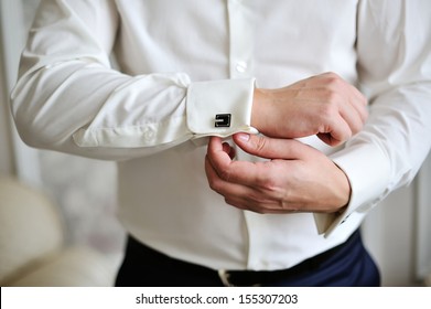 Men Wear A Shirt And Cufflinks