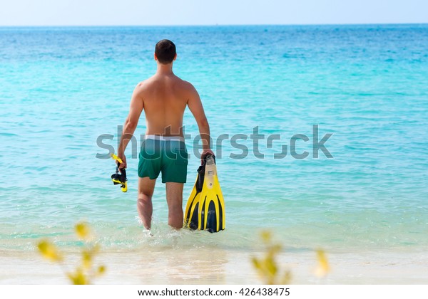 Download Men Wearing On Yellow Mask Flippers Stock Photo Edit Now 426438475 Yellowimages Mockups