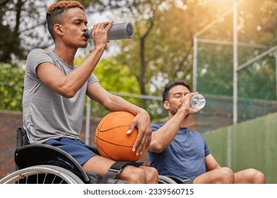Men in wheelchair, basketball players or drinking water for sports break, rest or court fitness electrolytes. People with a disability, athletes or workout friends with bottle for exercise recovery - Powered by Shutterstock