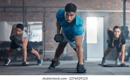 Men, woman and dumbbells in gym workout, training and exercise for strong body muscles, health and wellness. Portrait, sweat or fitness weightlifting class for people or friends with personal trainer - Powered by Shutterstock